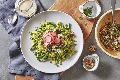 Basmati rice with green beans and peas topped with feta cheese and nuts | Arctic Gardens